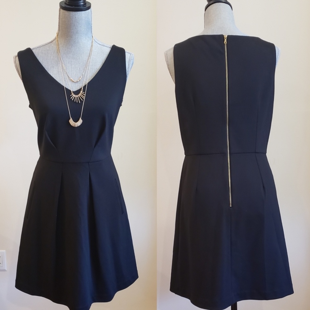 Black V-neck sleeveless dress with pockets